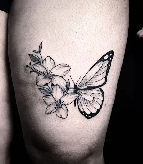 Half butterfly half flower forearm tattoo