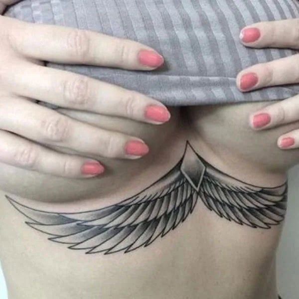 Wings Under Breast Tattoo