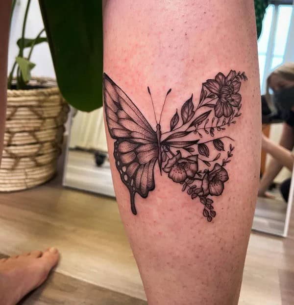 Half butterfly half flower forearm tattoo