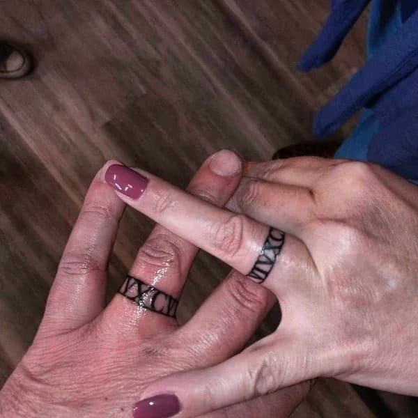 Roman Numeral Wedding Ring Tattoo