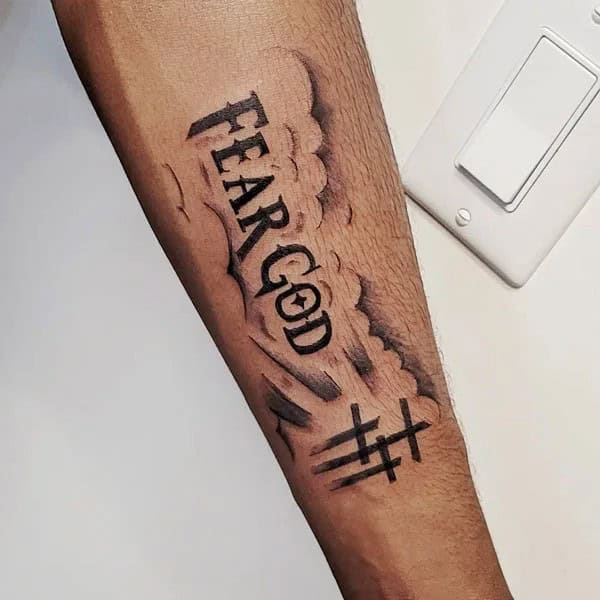 Fear God Tattoo on Forearm