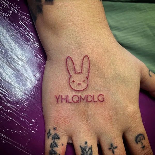 “YHLQMDLG”  Hand Tattoo