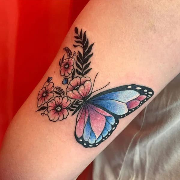 Half butterfly half flower forearm tattoo