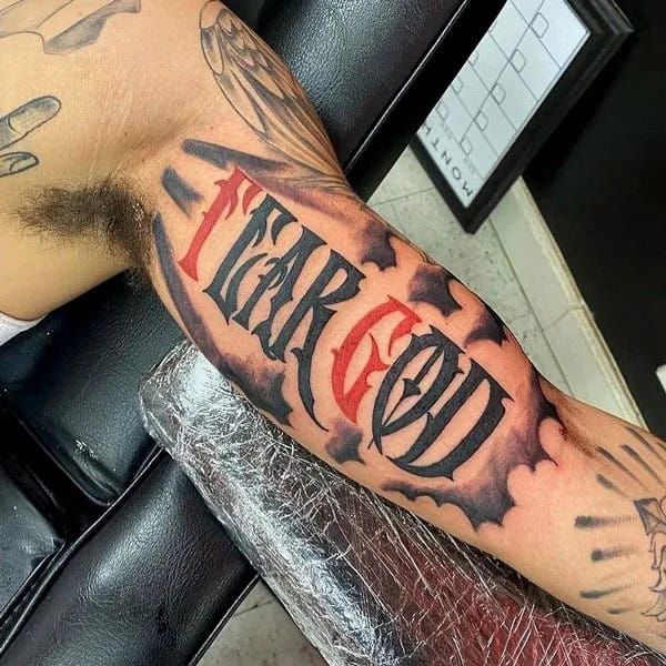 Fear God Tattoo on Bicep