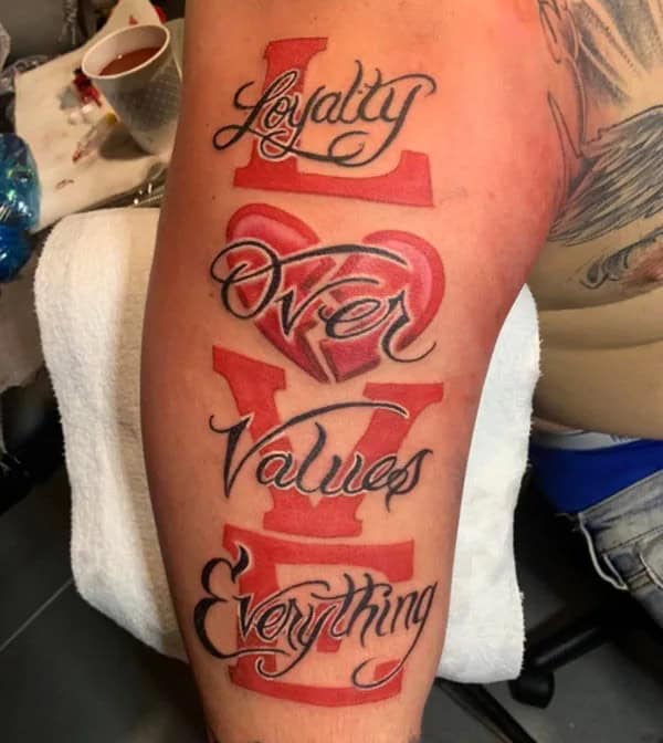 Loyalty Over Love Tattoo On Arm