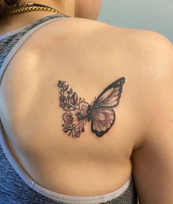 Half butterfly half flower forearm tattoo