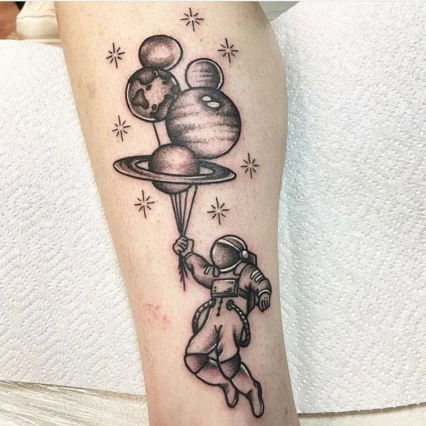 Astronaut Holding Earth Tattoo