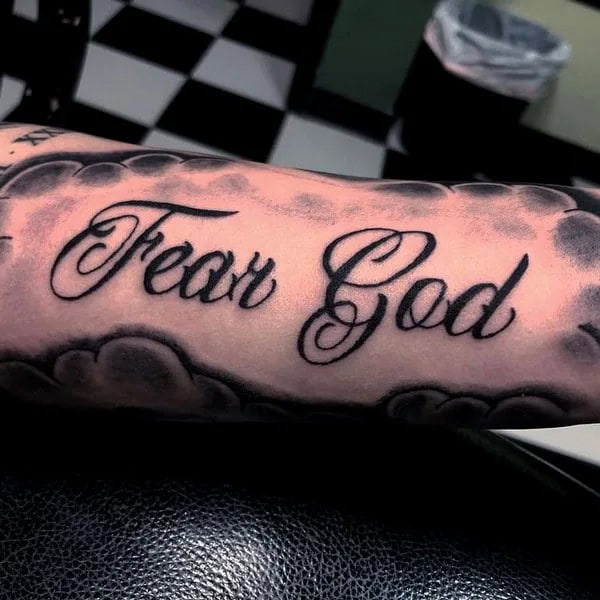 Fear God Tattoo on Forearm