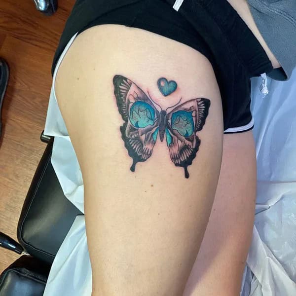 Butterfly Skull Thigh Tattoo