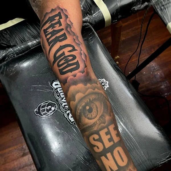 Fear God Tattoo on Bicep