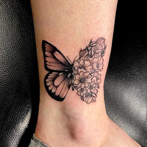 Half butterfly half flower forearm tattoo