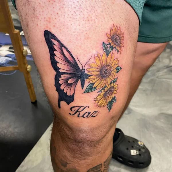 Half butterfly half flower above knee tattoo