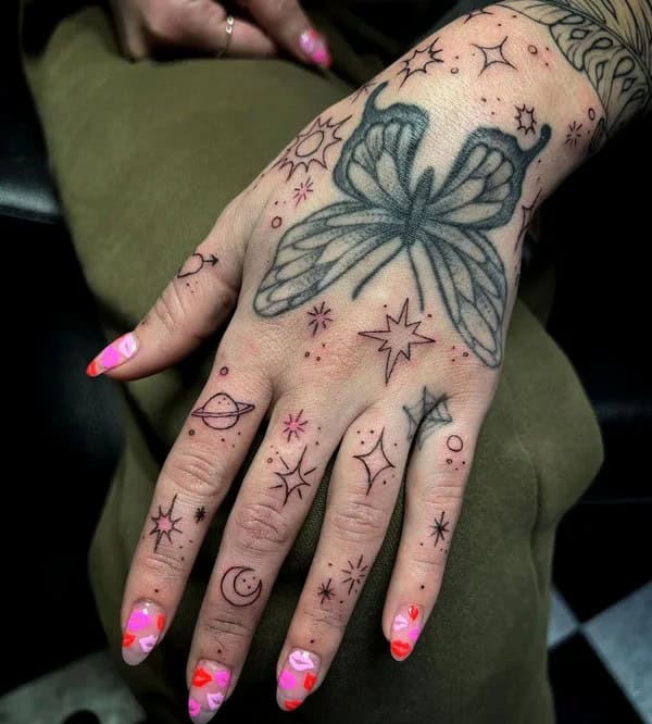 Space-esque Butterfly Hand Tattoo