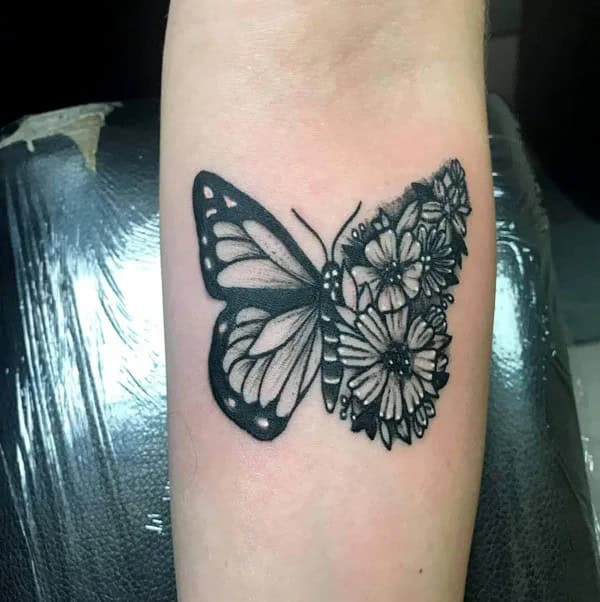 Half butterfly half flower forearm tattoo